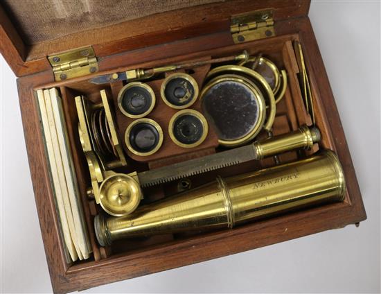 Two early 19th Century brass travelling microscopes, Rand of Newbury and another, with early slides.